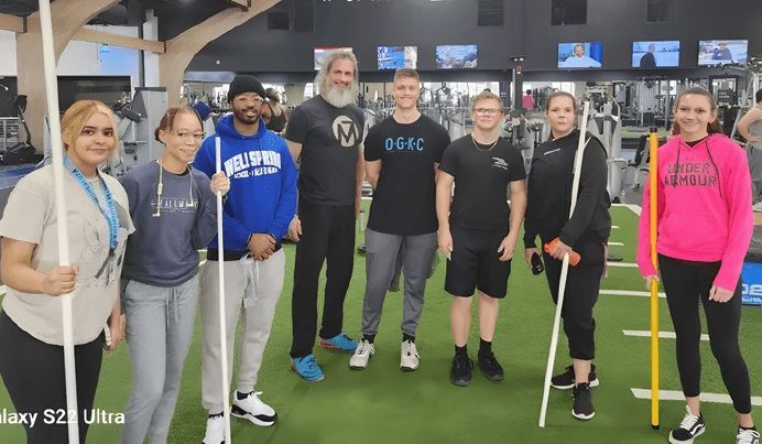 Group of people in the gym with Scott Lofquist